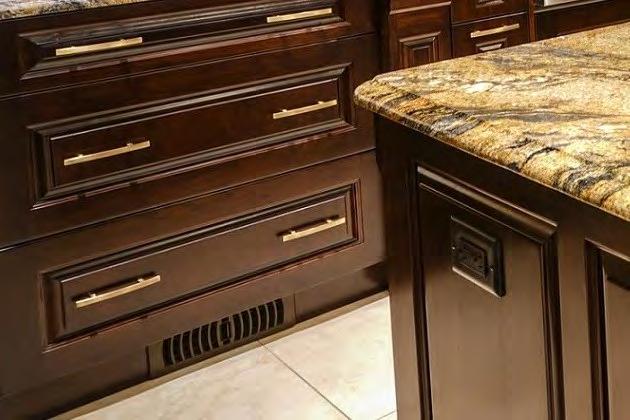 The kitchen cabinets produces a warm, luxurious feeling enhanced by the warm