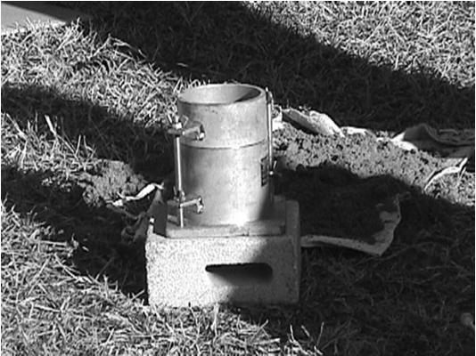 SC-T-29 Place standard mold (with base plate and collar attached) on block of concrete. SC-T-29 Obtain approx.