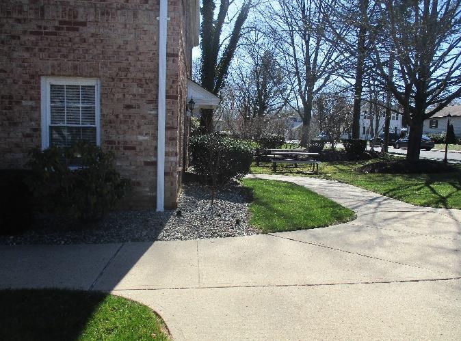 Downspouts can be disconnected and redirected into existing vegetation. A preliminary soil assessment suggests that the soils have suitable drainage characteristics for green infrastructure.