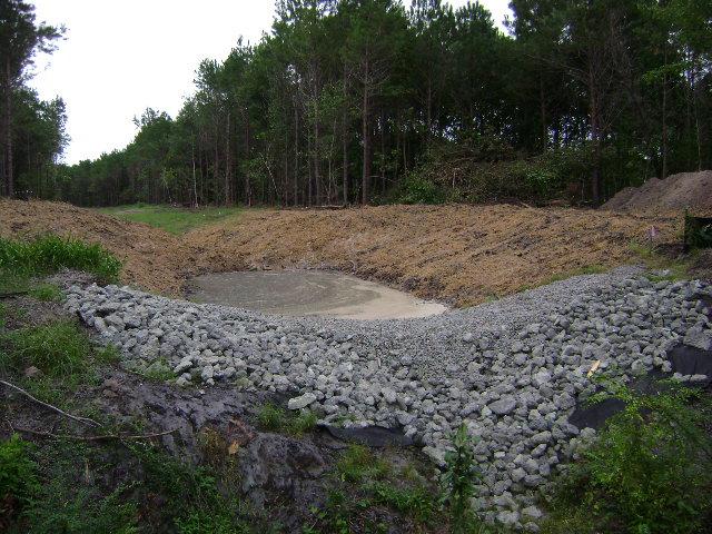 SEDIMENT TRAPS A trap constructed to collect water runoff, with adequate retention time to
