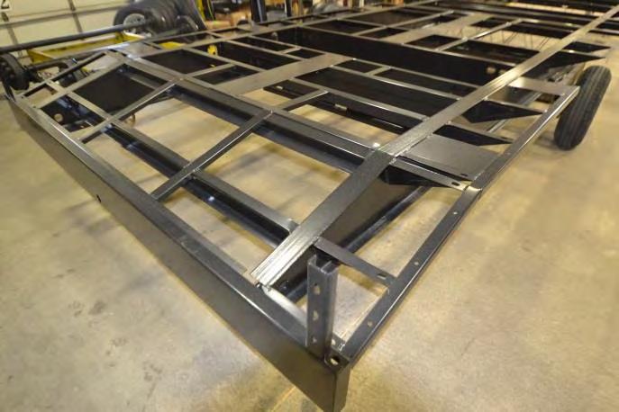 tie downs secured to welded steel plates on the chassis.