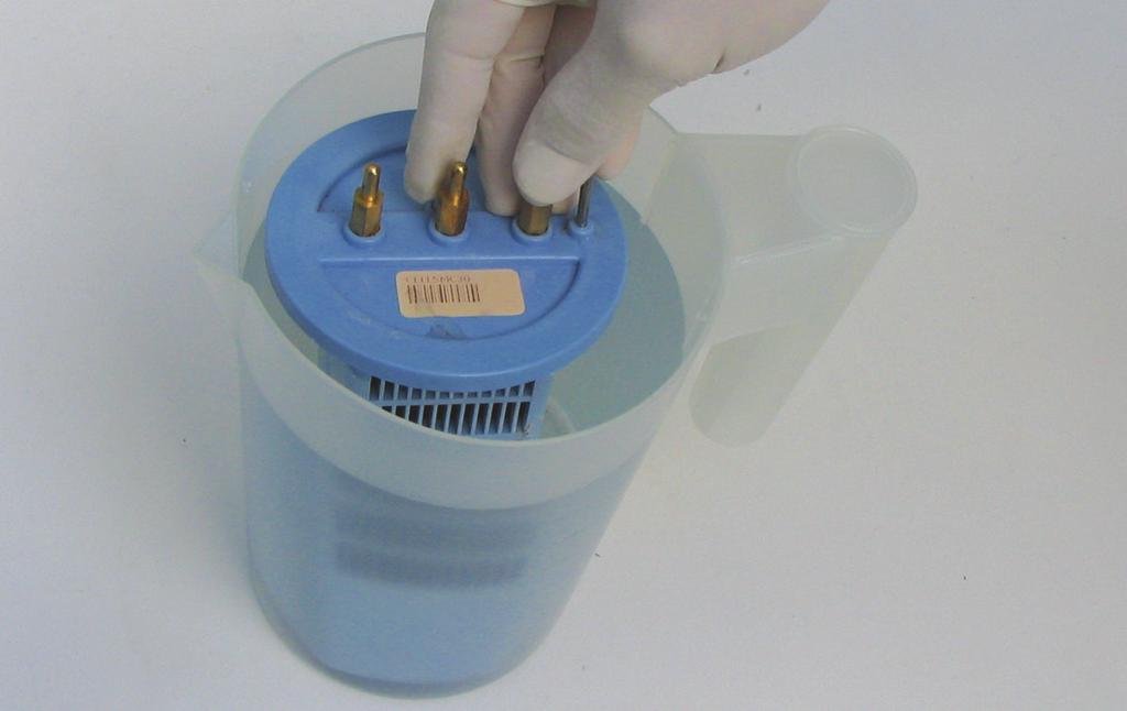 TM ELECTRODE CLEANING: Mix up a solution of 1 part hydrochloric acid to 8 parts water. Submerse the electrode in this solution, as shown in the picture below.