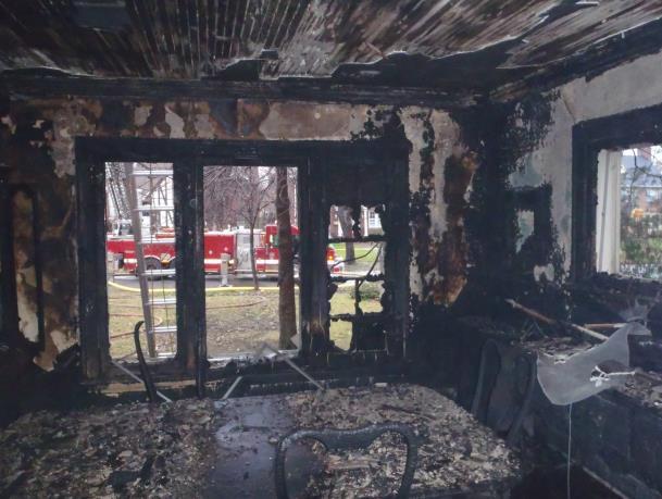 Fire patterns in this room indicate that the fire traveled from the foyer into the living room.