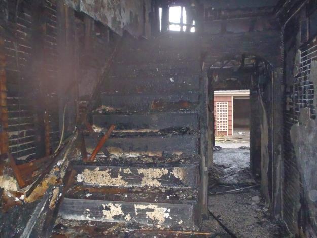 All fire patterns in the hallway indicate that the fire traveled from the first floor staircase to the second floor and then to all of the rooms on the second floor.