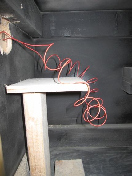 smoke source is introduced at one side of a narrow box. The NIST smoke source used wood sticks on a hot plate, intended to produce smoke gray in color.