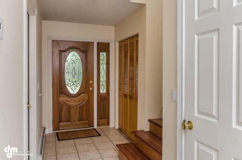 Classic tile flooring graces the foyer and hallway.