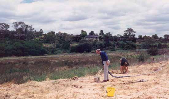 9 Warringal Conservation Society at Banyule Flats Motor pump obtains water from Swamp, Geoff Baker fills bucket.