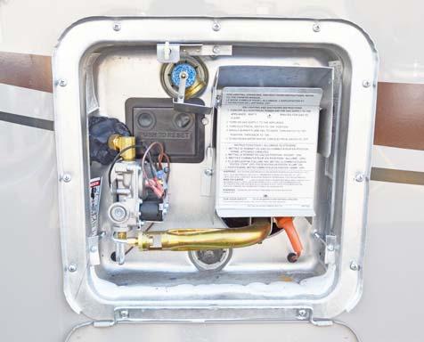 SECTION 4 APPLIANCES AND SYSTEMS Lift handle straight out to open P-T valve when water heater is cold.