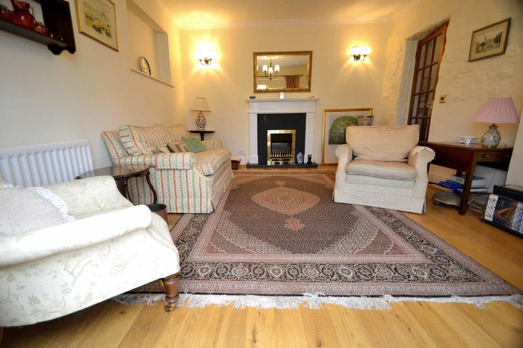 Sitting Room 14'7 x 11'10 (4.45m x 3.61m) Wooden flooring. Electric feature fireplace. Doors to: Conservatory 21'7 x 11'4 (6.58m x 3.45m) Rural views. Tiled flooring. Double doors to patio.