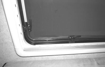 SECTION 2 SAFETY AND PRECAUTIONS To open, release all four latches and push window out. 1. Side Latches (2) - Pull down toward bottom of window frame. 2. Bottom Latches (2) - Pull toward the left-hand side of the window frame.
