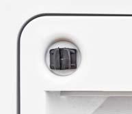 Use a screwdriver or coin to turn the latch knobs to the vertical position as shown. 2.