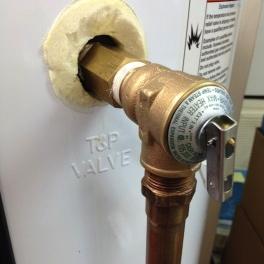 4. Drain sufficient water from the water heater such that the water level is below the level of the T&P valve.