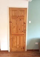 wood, six panel door with a brass effect