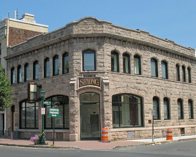 The Closter National Bank building was erected in 1913, long after the peak popularity of the Richardson Romanesque style in the 1880 s and 90 s.
