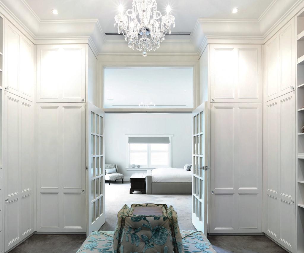 138 The large walk-in robe is custom designed and luxuriously furnished with modern features and plenty of storage The clients had a distinctive vision for their Californian bungalow mansion