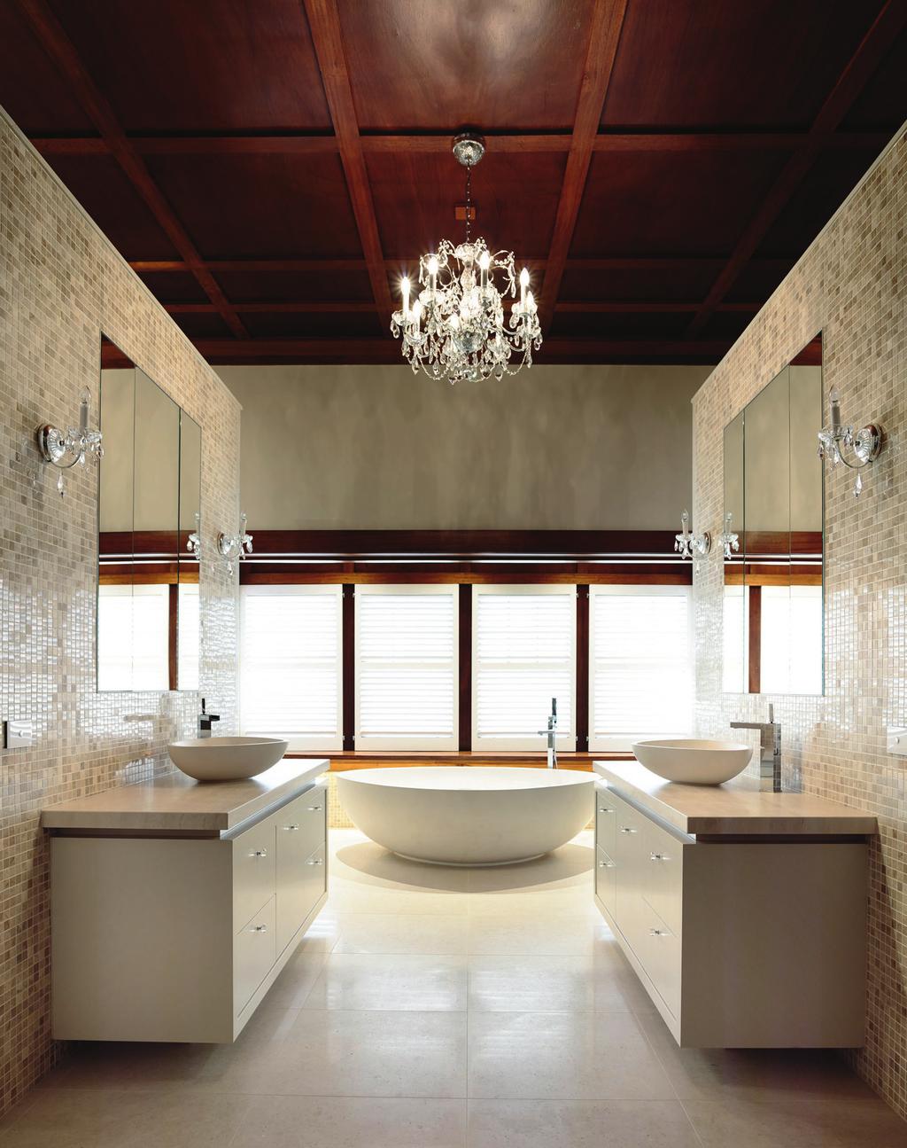 142 The timber finishes add a traditional feel to this dramatic and grand bathroom.