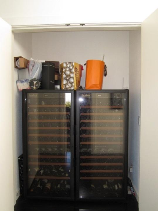 wine refrigerators within a Hall Closet.