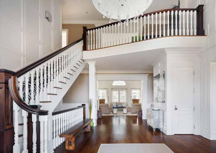 GRAND ENTRY Enter through the double-height foyer which opens to the expansive main living areas, including the living room with