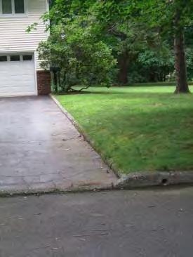 A sloped down driveway on Oak Street offers opportunity for pervious pavement.