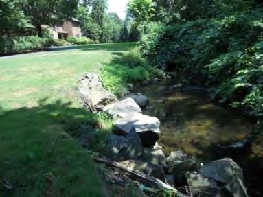 The brook is accessible from a location near Sunset Road. Residential lawns contain little to no buffers.