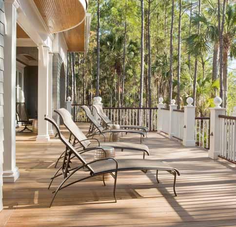 (above) The outside deck is perfect for guests and offers excellent views of the marsh and water. (right) The dining room is simple yet elegant with French doors leading to the outside.