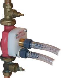 One end of both flow and return hoses should be screwed onto the corresponding ¾ brass nipples on either side of the Clearflow pump, adjacent to the blue metal valve support brackets.