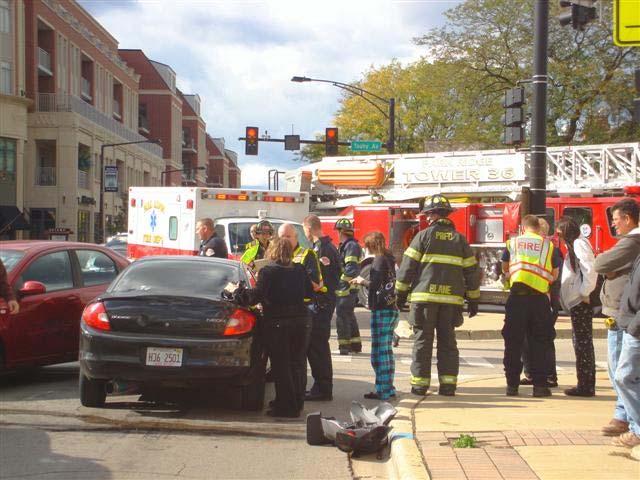 Park Ridge Paramedics attend to patients at an accident scene.