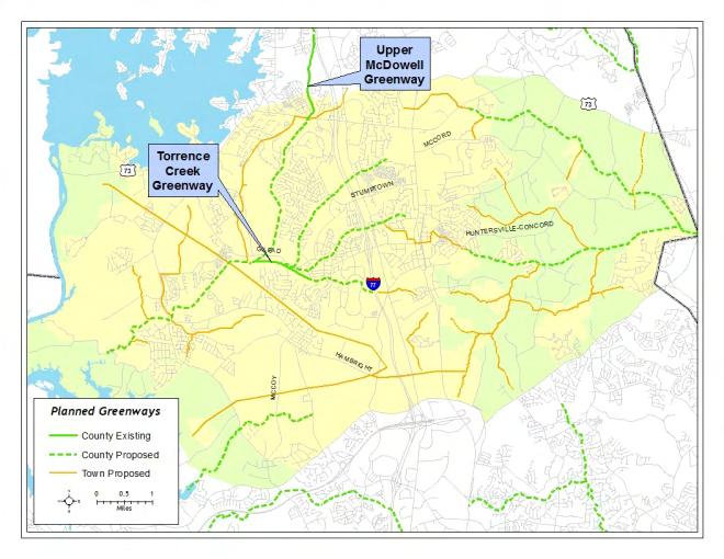 Map T-4 Existing and Planned Greenways For new development, reservation, dedication or construction of greenway trails is required by the Town s land use regulations. The latter option (i.e. construction) may be needed to meet the Urban Open Space, or Open Space requirements for a particular development proposal.