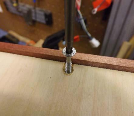 Remove the six bottom cabinet screws using a T-20