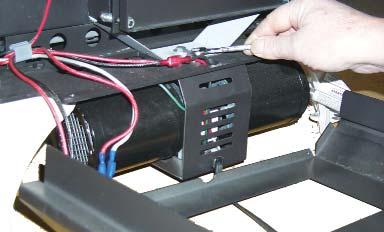 8) Place the blower close to the base of the unit and feed the long red and black wires through