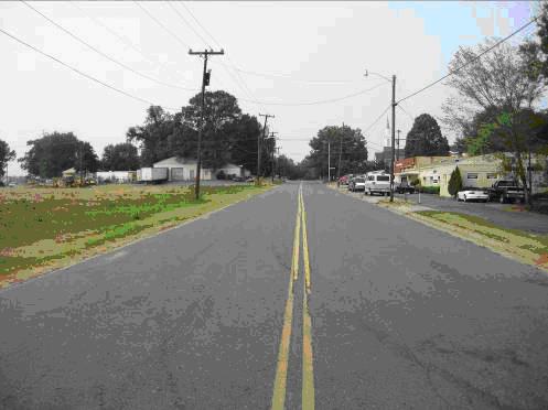 ) Old Pineville Road is two travel lanes wide, with bike lanes (both sides) and sidewalk (on the west side).