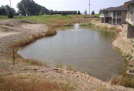 4.2 RETENTION POND Figure 4.2. Retention pond (Source: Department of Civil, Construction, and Environmental Engineering, Iowa State University) Description: A permanent pool of water that has the