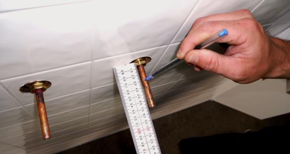 Measure the copper 30mm off the wall and cut at this measurement on both pieces of copper (that are protruding out of the wall).