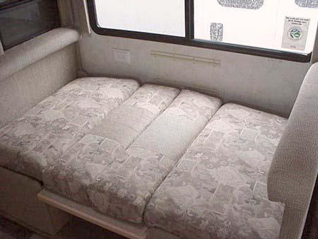 SECTION 9 FURNITURE & SOFTGOODS 3. Arrange dinette cushions to cover bed area.