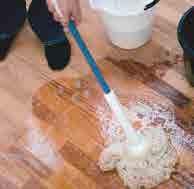 Clean the floor lengthwise. It is recommendable to work with two buckets one with rinse water for the wringing out of the mop and another one with the soap solution.