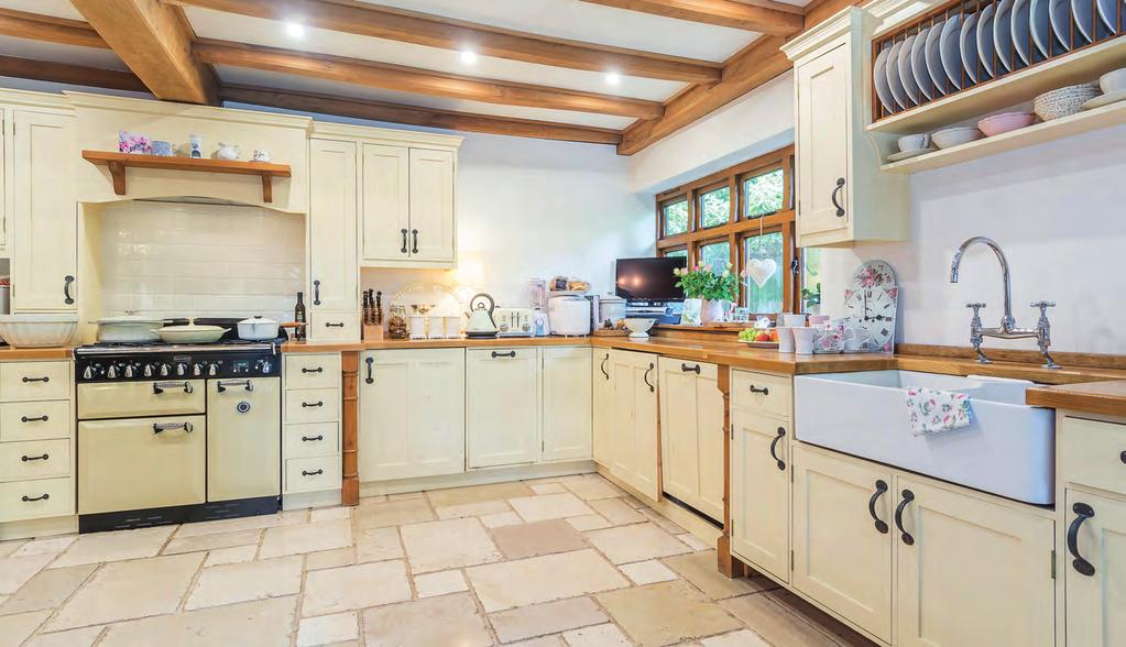 Leading off the hallway is the fully fitted and stunningly presented country kitchen, complete with a Rangemaster with a gas hob and electric oven, Zanussi dishwasher, Hotpoint washer/dryer, built in