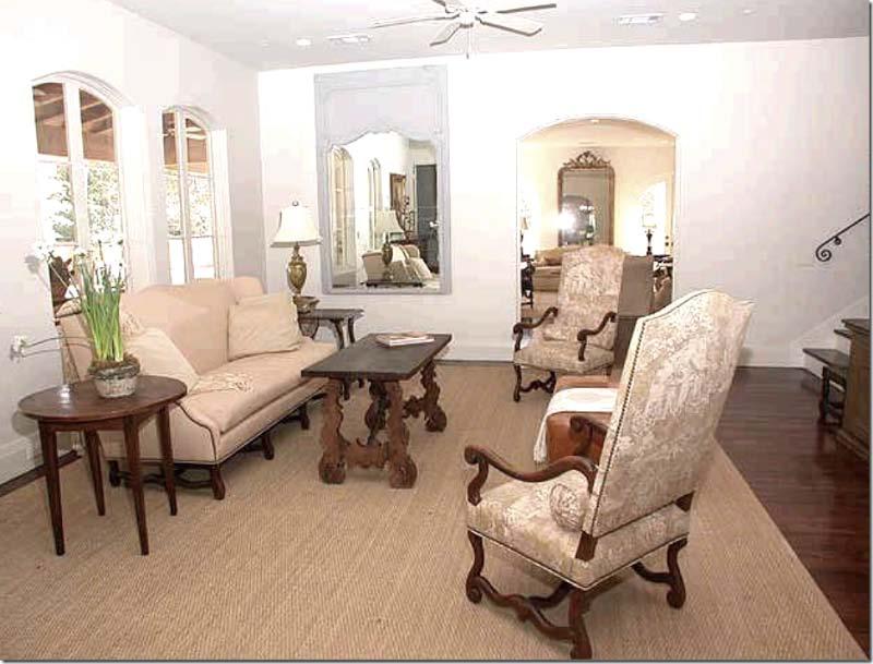 The Family Room: The original owners decorated the family room with French styled chairs and sofa. Love the two tall chairs with toile fabric.