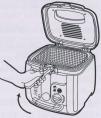 Fill fryer with vegetable oil to the MAX fill line, about 11 cups. Do not fill fryer beyond MAX fill line to prevent boil-over of hot oil when food is added.