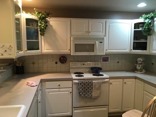 1. Kitchen Room Kitchen Walls and ceilings appear in good condition overall. Flooring is vinyl. Heat register present.