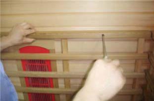 E. Installing the BACK PROTECTION Grid (Ceramic Model Saunas Only) 1. Screw the BACK PROTECTION FRAME onto the REAR PANEL. (see Figure 16) Figure 16 F.