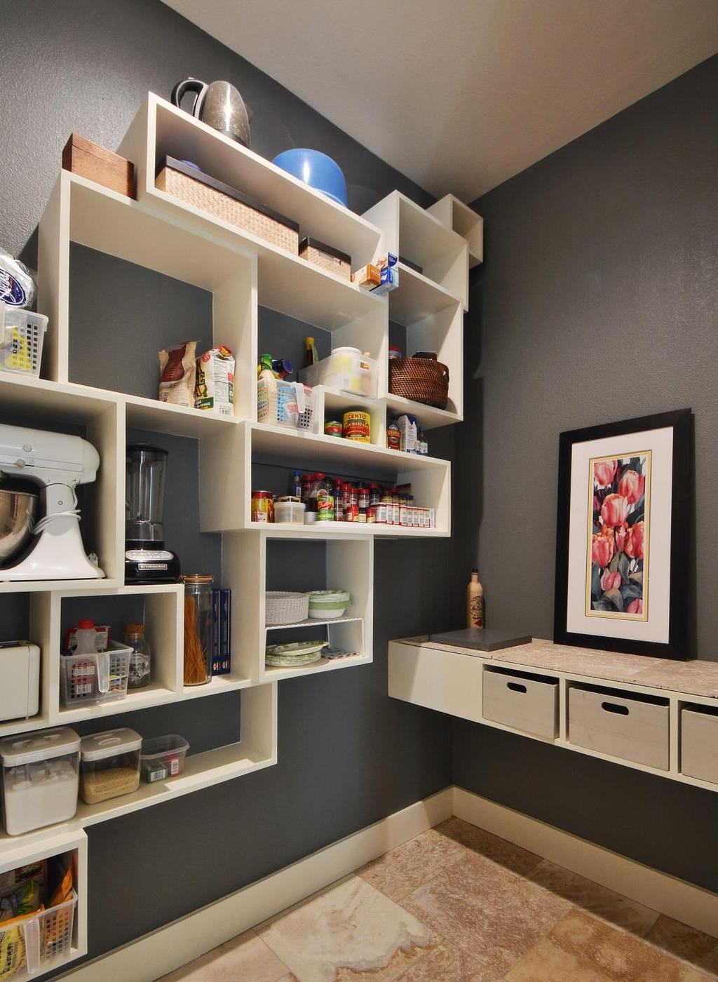 Unique pantry design offers multiple storage options. Cubbies of varying heights, widths and DEPTHS were specifically measured and built to hold common pantry items.