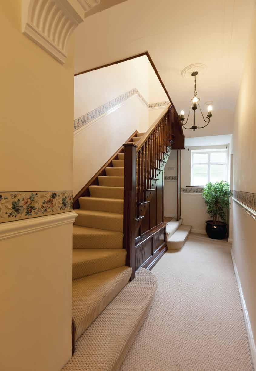 Rose Cottage A Superb Detached Family Home with Excellent Equestrian Facilities. Stairs with timber spindles and hand rail rise to first floor landing with quarter turn.