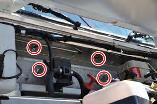 5. Use a 9/16" socket wrench to remove (4) nuts and washers connecting the heater plenum studs to the cowl. Cowl fasteners under hood 6.