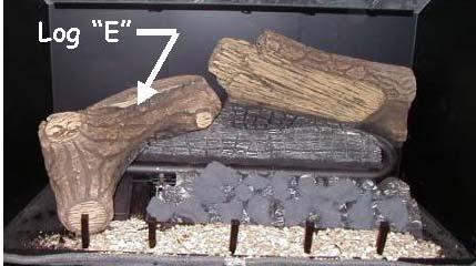 7. Place left front log E as shown.
