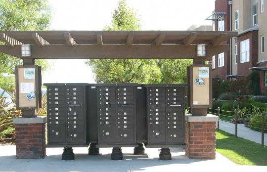using landscaping or other architectural or aesthetic features. Screening using cages, grates or boxes is discouraged. Figure 29: Trash enclosure for a dumpster.