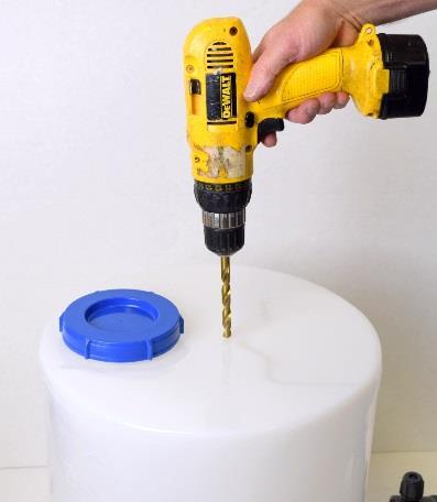 Drill the pilot holes with a drill bit so that the pump can be mounted on the tank with two