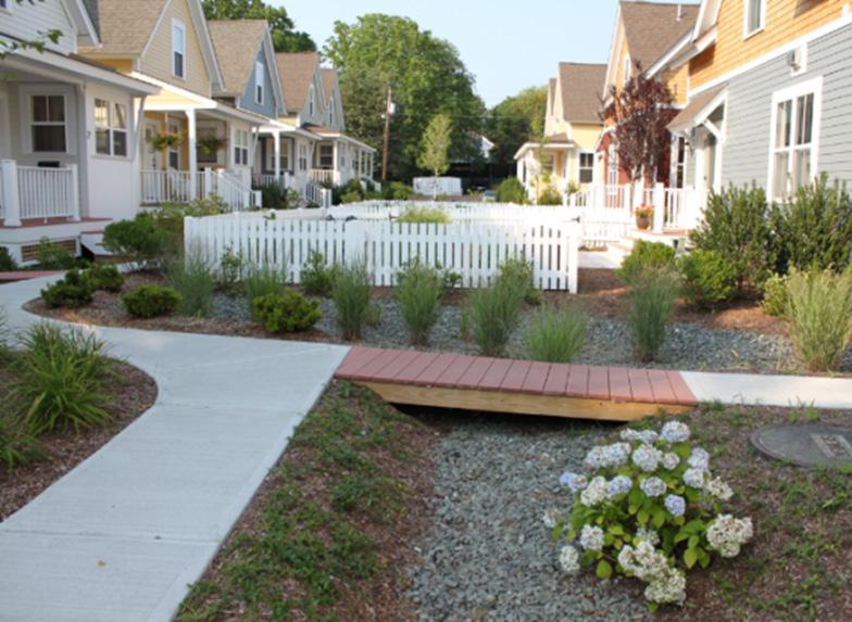 As highlighted in the sidebar, green infrastructure provides significant environmental, social, and economic benefits beyond those of traditional (also known as grey ) stormwater and flood management