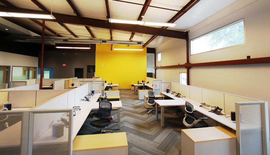Previous workspaces Top: In their shared, open office space, staff have