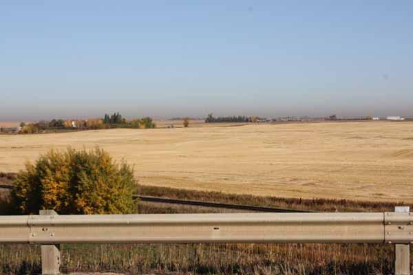 Photo 2 View from Highway 22X to North West showing existing agricultural and CPR rail
