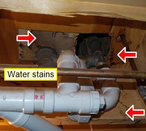 plumbing, but no evidence of any active leaks. It is not possible to determine how old the stains are.